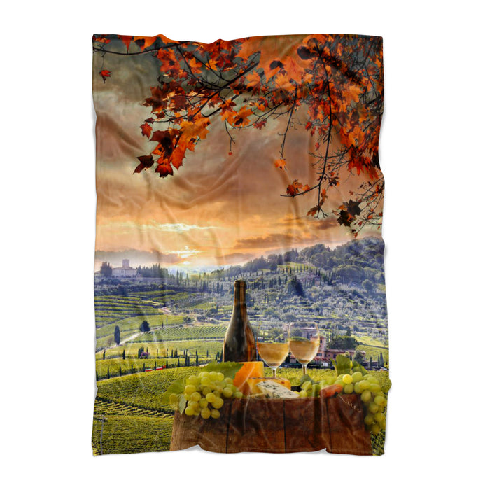 Chianti, Tuscany blanket with a scenic design of a vineyard, wine bottle, and glasses.