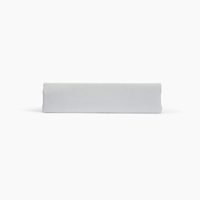 Avec linen classic top sheet in fog folded neatly on a white background