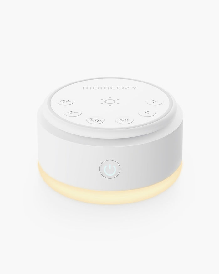 Momcozy Baby Sound Machine - Portable and compact white sound machine with warm light for better sleep.