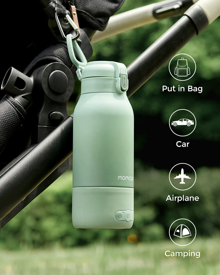Momcozy portable breast milk and water warmer, mint green, with travel icons. Ideal for warming milk on the go.