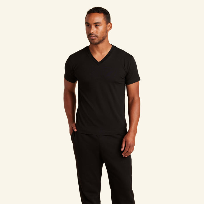 Man wearing the Slumber Cloud Essential V-Neck made with Outlast temperature regulation technology