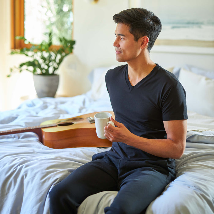 Man wearing the Slumber Cloud Essential V-Neck made with Outlast temperature regulation technology